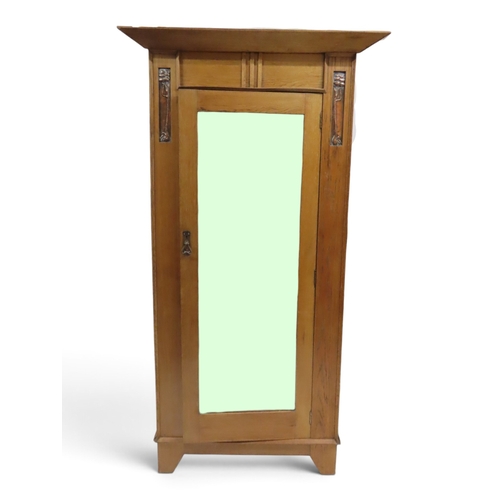 2033 - AN EARLY 20TH CENTURY OAK ARTS & CRAFTS TWO PIECE BEDROOM SUITEcomprising wardrobe with sloped c... 