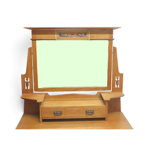 2033 - AN EARLY 20TH CENTURY OAK ARTS & CRAFTS TWO PIECE BEDROOM SUITEcomprising wardrobe with sloped c... 