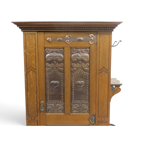 2035 - A 19TH CENTURY OAK ARTS & CRAFTS HALL ROBEwith moulded cornice over single panelled door inset w... 