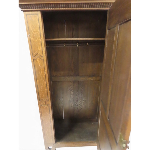2035 - A 19TH CENTURY OAK ARTS & CRAFTS HALL ROBEwith moulded cornice over single panelled door inset w... 