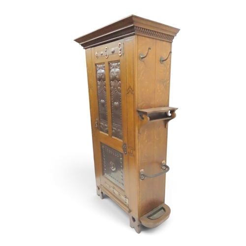 2035 - A 19TH CENTURY OAK ARTS & CRAFTS HALL ROBEwith moulded cornice over single panelled door inset w... 