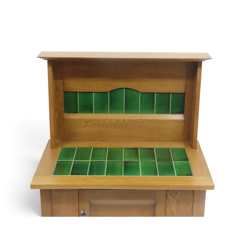 2037 - AN EARLY 20TH CENTURY OAK ARTS & CRAFTS STYLE WASH STAND&nbsp;with stylized tile inset splashbac... 