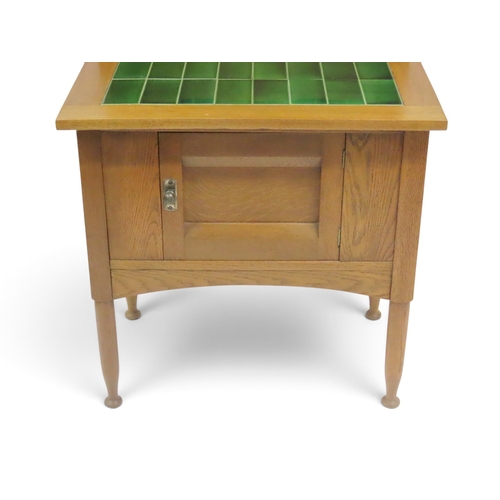2037 - AN EARLY 20TH CENTURY OAK ARTS & CRAFTS STYLE WASH STAND&nbsp;with stylized tile inset splashbac... 