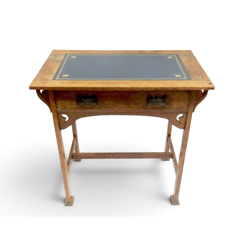 2039 - A 19TH CENTURY OAK ARTS & CRAFTS LADIES WRITING DESK&nbsp;with blue embossed skiver top over sin... 