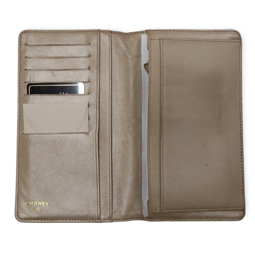 8057 - A Chanel Camellia long wallet in pink lambskin with gold-tone hardware With Chanel authenticity card... 