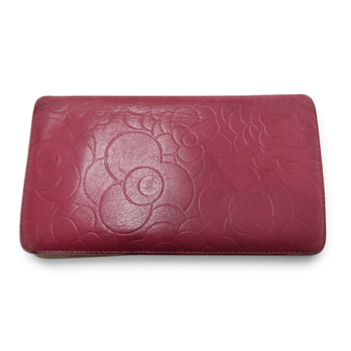 8057 - A Chanel Camellia long wallet in pink lambskin with gold-tone hardware With Chanel authenticity card... 