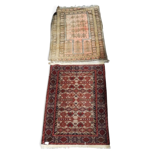 10 - A lot comprising a beige ground Kuba Perepedil rug with multicoloured geometric patterned ground wit... 