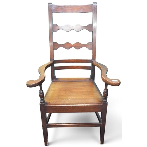 15 - An early 20th century stained beech ladder backed armchair with scrolled armrests flanking plain sea... 