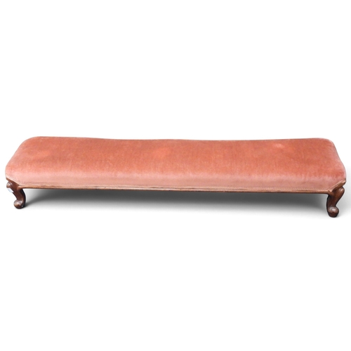 22 - A late 19th century walnut framed bolster stool with pink upholstery on serpentine supports, 18cm hi... 