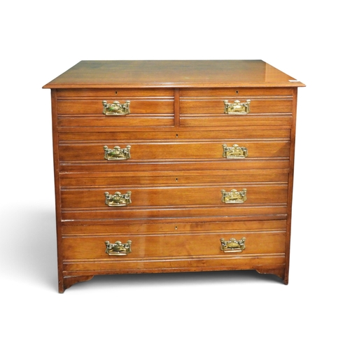 27 - An early 20th century oak two over three chest of drawers with embossed brass drawer pulls, 100cm hi... 