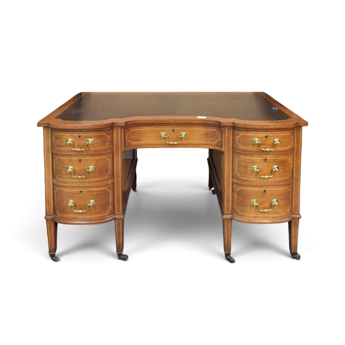 30 - A Victorian walnut writing desk with shaped black skivered top over single long frieze drawer and kn... 