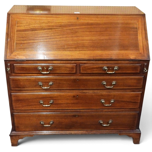 36 - A 19th century mahogany writing bureau with fitted fall front writing compartment over two short and... 