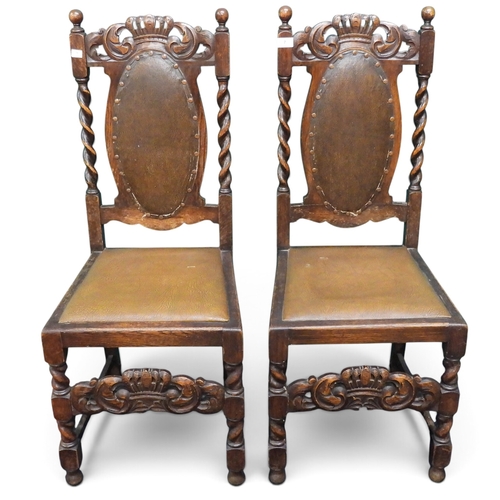 7 - A pair of late 19th century oak hall chairs with brown Rexine upholstered back and seats surmounted ... 