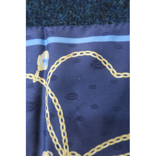 8050 - A Cartier silk scarf with design of gold chains and charms on dark blue groundwith box and authentic... 