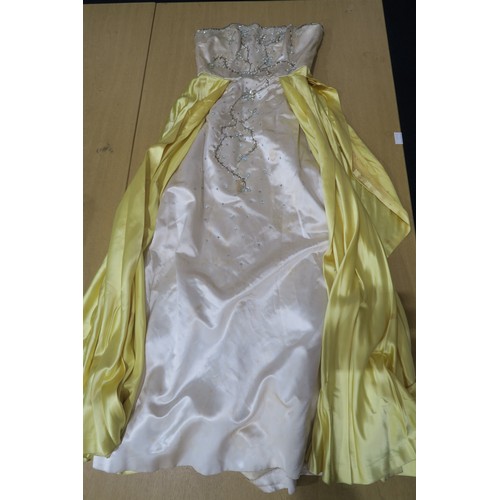 8000 - Circa 1950s ladies evening wear comprising a white fox stole, a silk gown with bead embroidery by Si... 