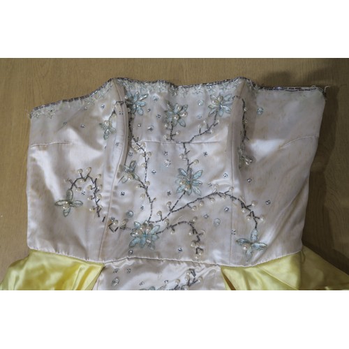 8000 - Circa 1950s ladies evening wear comprising a white fox stole, a silk gown with bead embroidery by Si... 