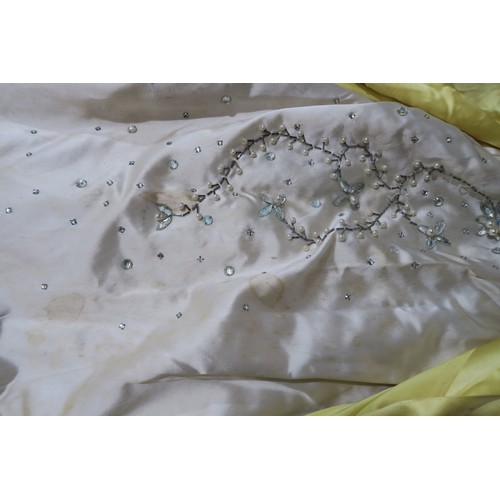 8000 - Circa 1950s ladies evening wear comprising a white fox stole, a silk gown with bead embroidery by Si... 