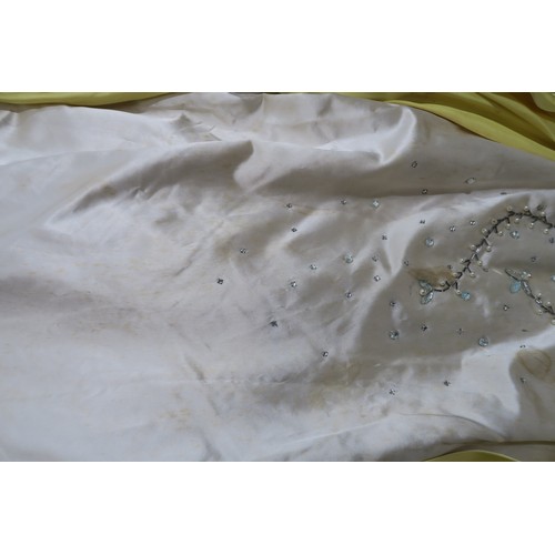 8000 - Circa 1950s ladies evening wear comprising a white fox stole, a silk gown with bead embroidery by Si... 