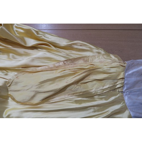 8000 - Circa 1950s ladies evening wear comprising a white fox stole, a silk gown with bead embroidery by Si... 