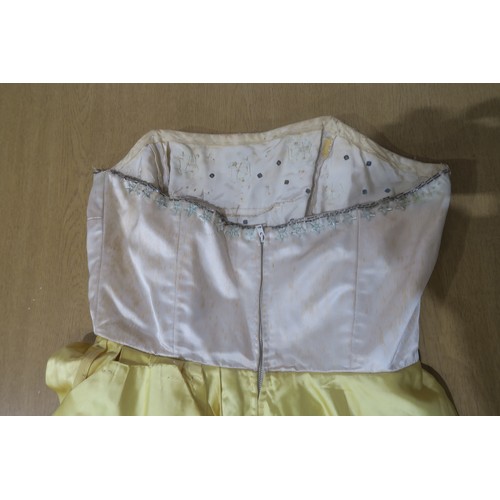 8000 - Circa 1950s ladies evening wear comprising a white fox stole, a silk gown with bead embroidery by Si... 