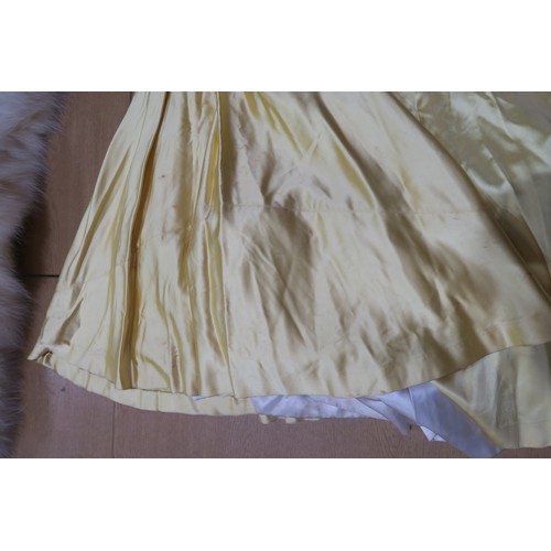 8000 - Circa 1950s ladies evening wear comprising a white fox stole, a silk gown with bead embroidery by Si... 