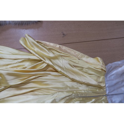 8000 - Circa 1950s ladies evening wear comprising a white fox stole, a silk gown with bead embroidery by Si... 