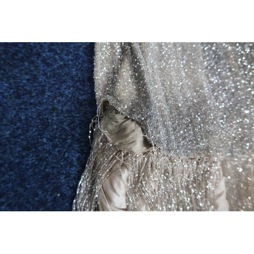 8003 - A 1920s flapper dress with scoop neckline, beaded drop waist silhouette and beaded fringe skirt, the... 