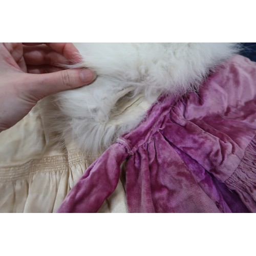 8005 - A circa 1930s pink silk velvet cape with white fox fur collar, lined with champagne satin; a blue si... 