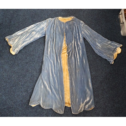 8005 - A circa 1930s pink silk velvet cape with white fox fur collar, lined with champagne satin; a blue si... 