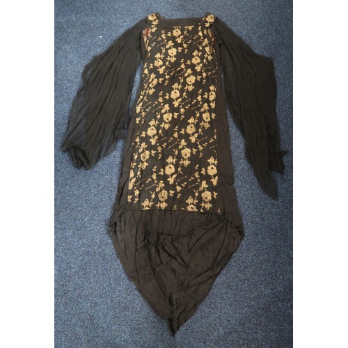 8006 - A 1920s black chiffon evening dress woven with metallic threads in floral design, with chiffon hangi... 