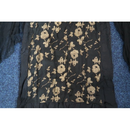 8006 - A 1920s black chiffon evening dress woven with metallic threads in floral design, with chiffon hangi... 