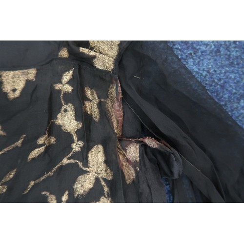 8006 - A 1920s black chiffon evening dress woven with metallic threads in floral design, with chiffon hangi... 