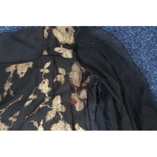 8006 - A 1920s black chiffon evening dress woven with metallic threads in floral design, with chiffon hangi... 