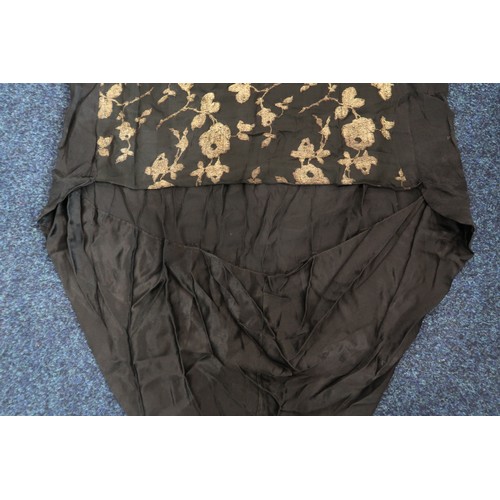 8006 - A 1920s black chiffon evening dress woven with metallic threads in floral design, with chiffon hangi... 
