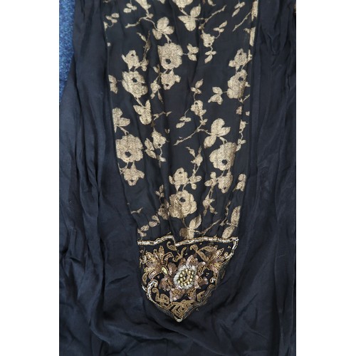8006 - A 1920s black chiffon evening dress woven with metallic threads in floral design, with chiffon hangi... 