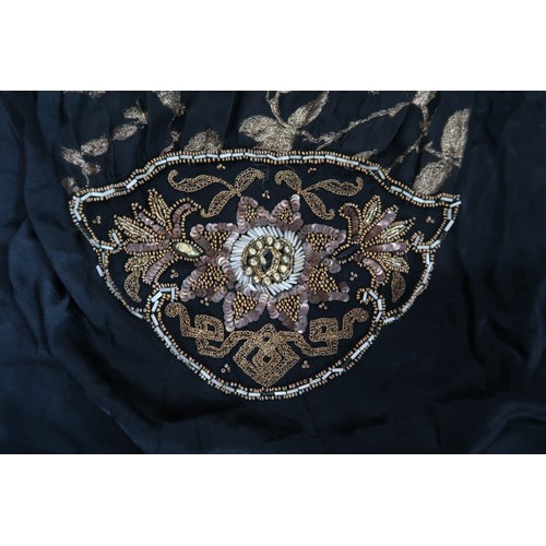 8006 - A 1920s black chiffon evening dress woven with metallic threads in floral design, with chiffon hangi... 