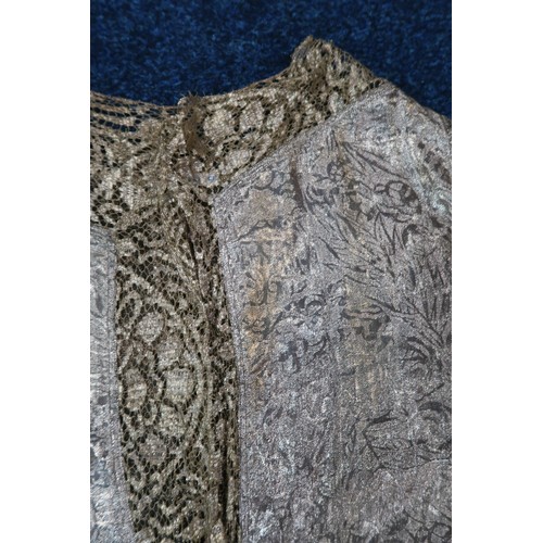 8006 - A 1920s black chiffon evening dress woven with metallic threads in floral design, with chiffon hangi... 