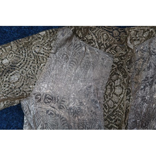 8006 - A 1920s black chiffon evening dress woven with metallic threads in floral design, with chiffon hangi... 