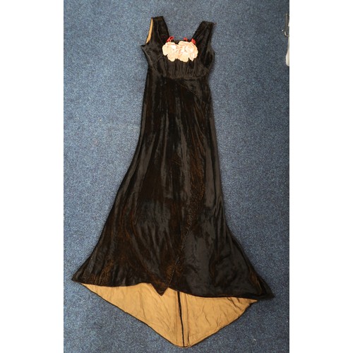 8007 - A 1930s black nacré velvet evening gown with applied velvet flower corsage by Reville London; togeth... 
