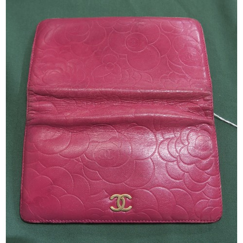 8057 - A Chanel Camellia long wallet in pink lambskin with gold-tone hardware With Chanel authenticity card... 