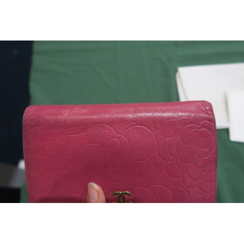 8057 - A Chanel Camellia long wallet in pink lambskin with gold-tone hardware With Chanel authenticity card... 