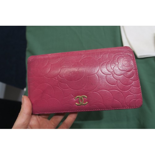 8057 - A Chanel Camellia long wallet in pink lambskin with gold-tone hardware With Chanel authenticity card... 
