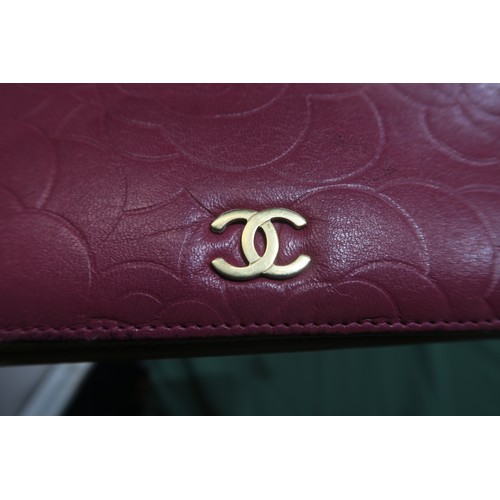 8057 - A Chanel Camellia long wallet in pink lambskin with gold-tone hardware With Chanel authenticity card... 