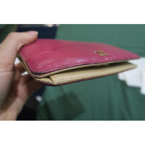 8057 - A Chanel Camellia long wallet in pink lambskin with gold-tone hardware With Chanel authenticity card... 