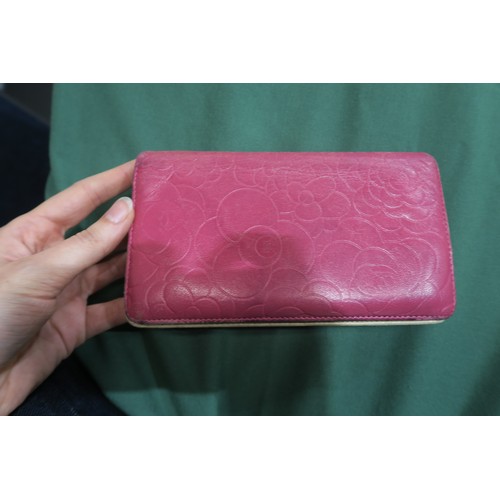 8057 - A Chanel Camellia long wallet in pink lambskin with gold-tone hardware With Chanel authenticity card... 