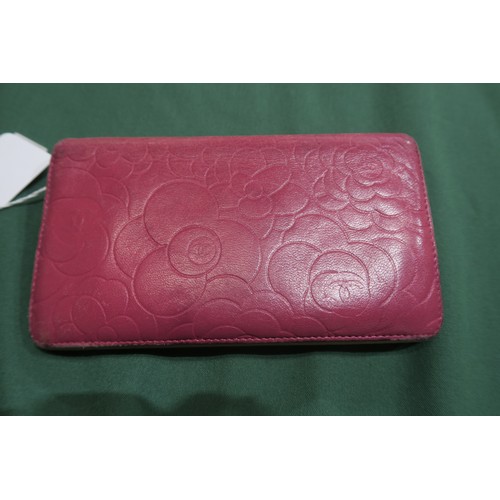 8057 - A Chanel Camellia long wallet in pink lambskin with gold-tone hardware With Chanel authenticity card... 