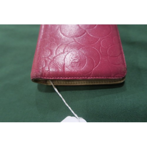 8057 - A Chanel Camellia long wallet in pink lambskin with gold-tone hardware With Chanel authenticity card... 