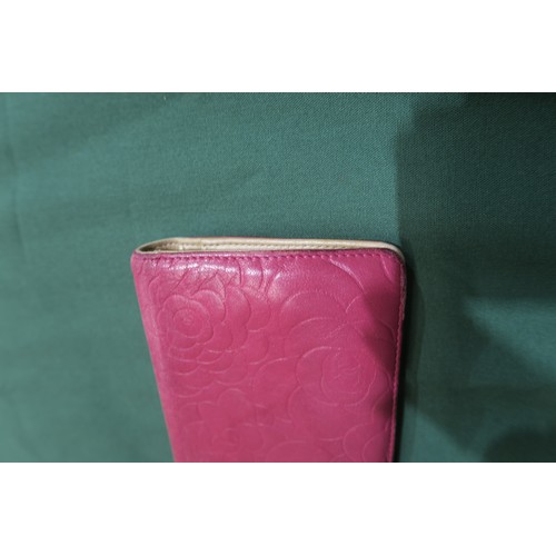 8057 - A Chanel Camellia long wallet in pink lambskin with gold-tone hardware With Chanel authenticity card... 