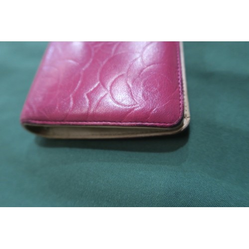 8057 - A Chanel Camellia long wallet in pink lambskin with gold-tone hardware With Chanel authenticity card... 