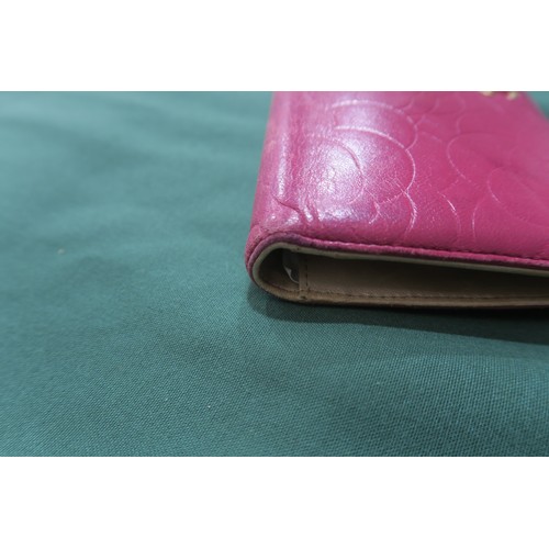 8057 - A Chanel Camellia long wallet in pink lambskin with gold-tone hardware With Chanel authenticity card... 